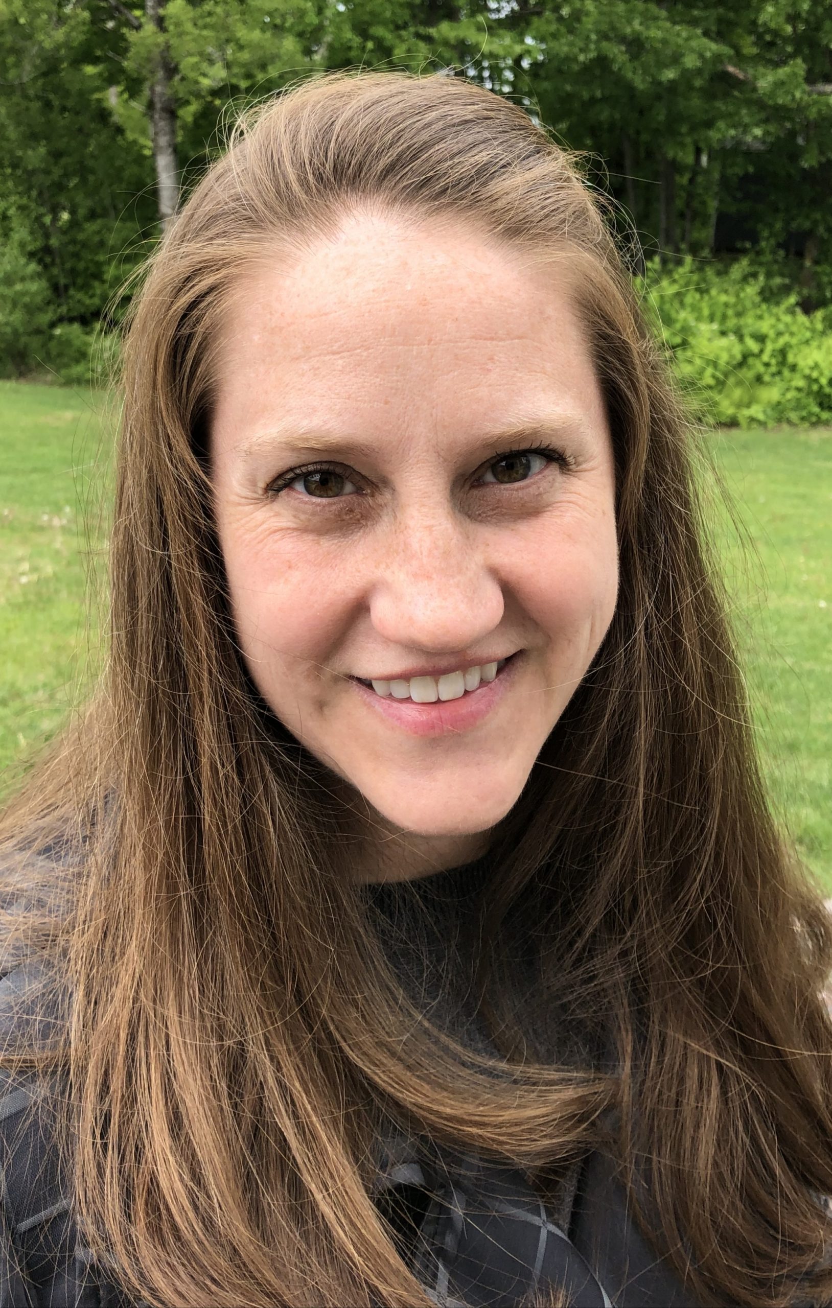 smiling woman in nature